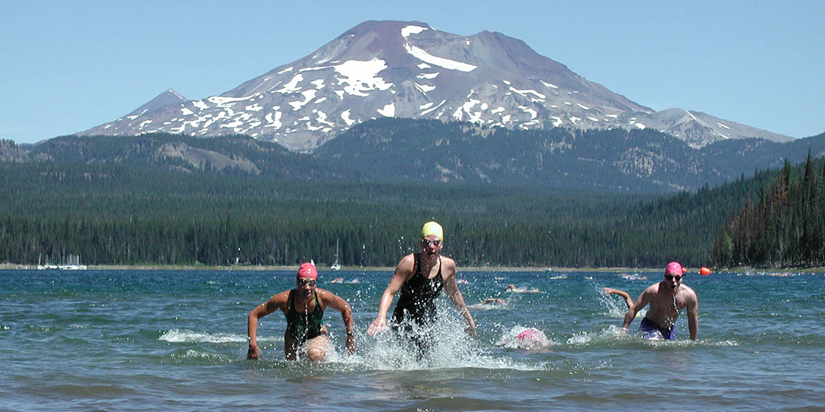Swimmers emerge from the water.